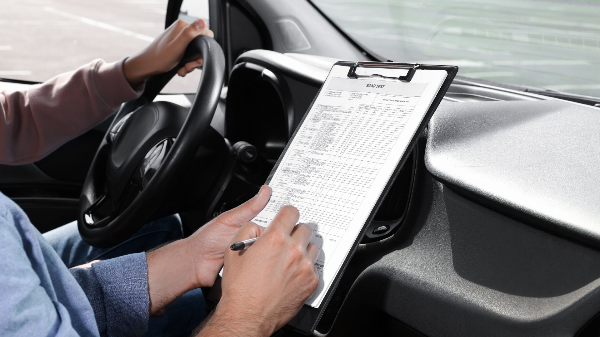 A learner driver at the wheel during a lesson in an automatic car